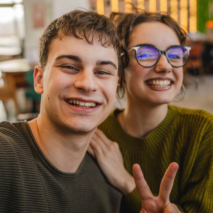 young man and woman with a close friendship smiling in a selfie