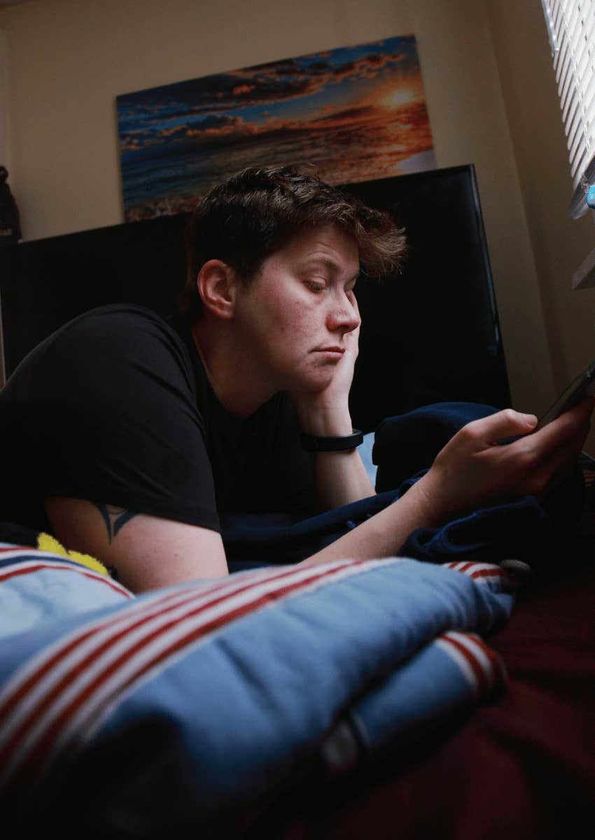serious young man focused on his phone