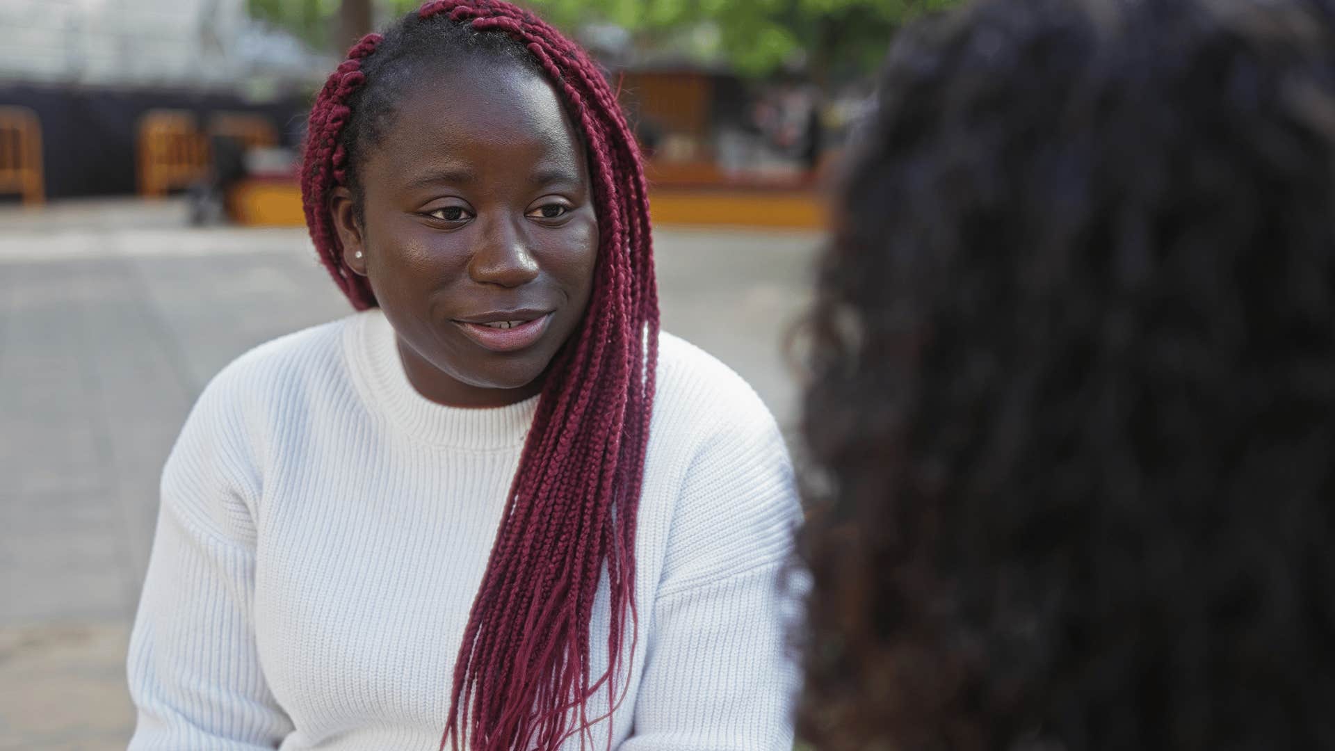emotionally struggling woman telling friend i'm fine