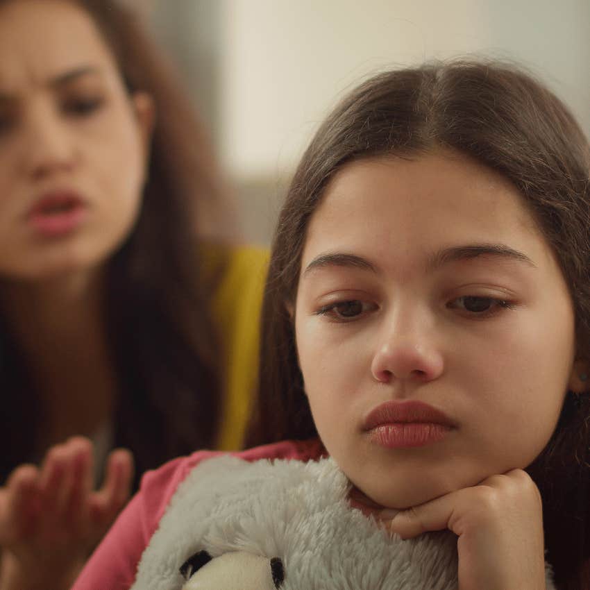 woman struggling to parent her child due to her own critical parents