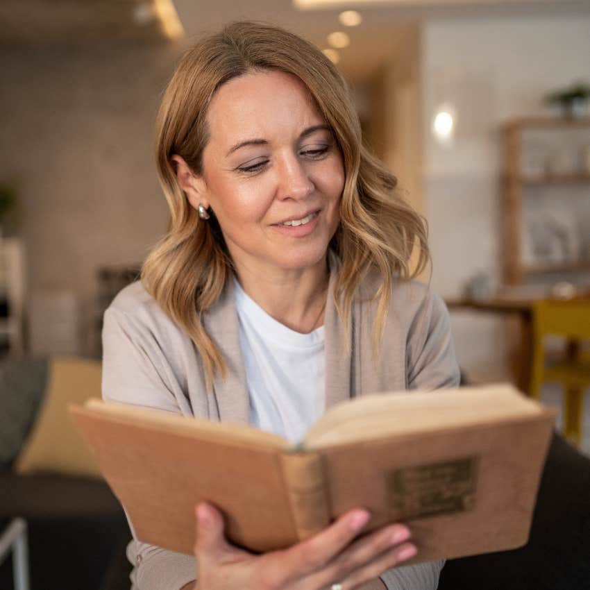 older woman avoiding stagnancy and reading a book