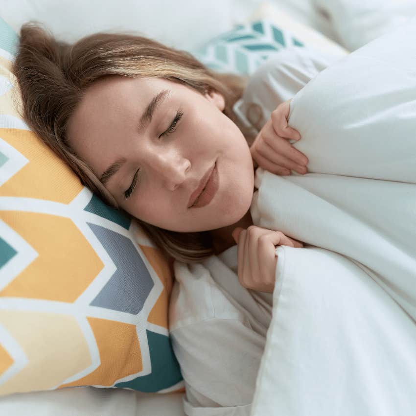happy woman sleeping after using a white noise machine