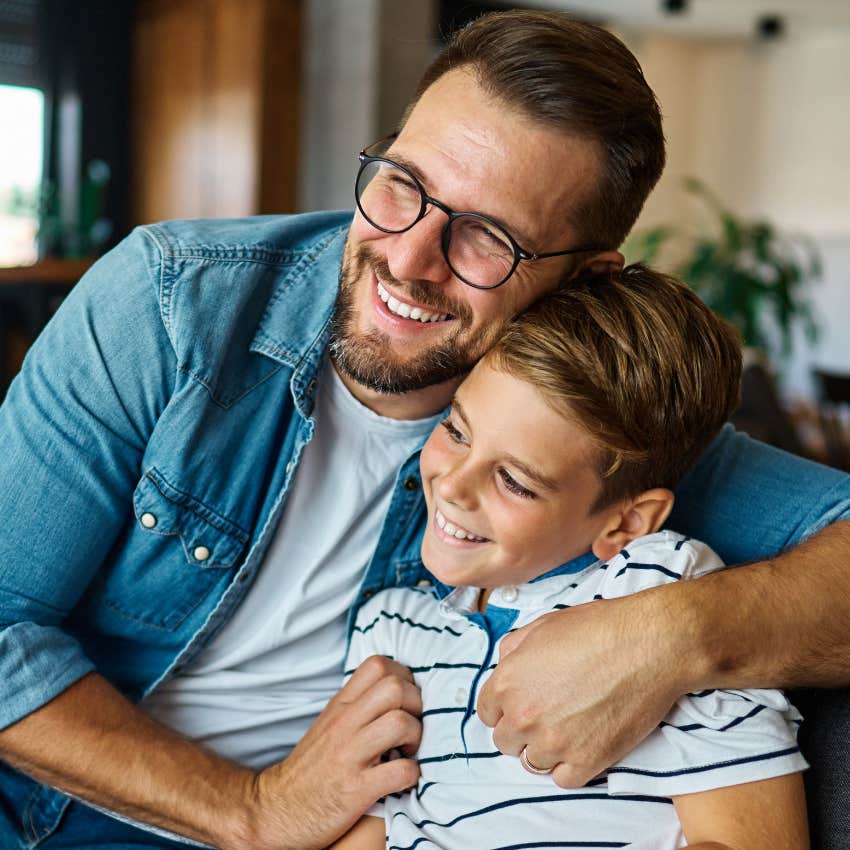 loving dad embracing son saying we love you