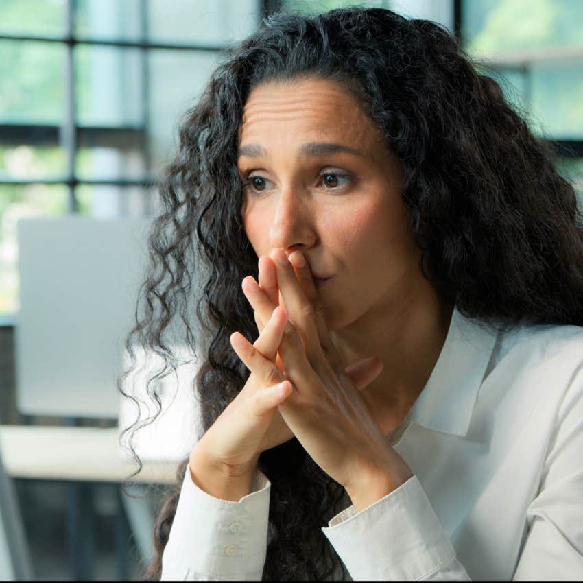 Woman dealing with imposter syndrome at work