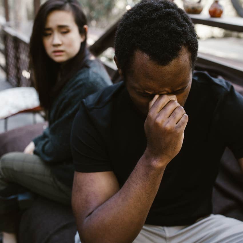 woman asking man cant you just be happy while he looks upset