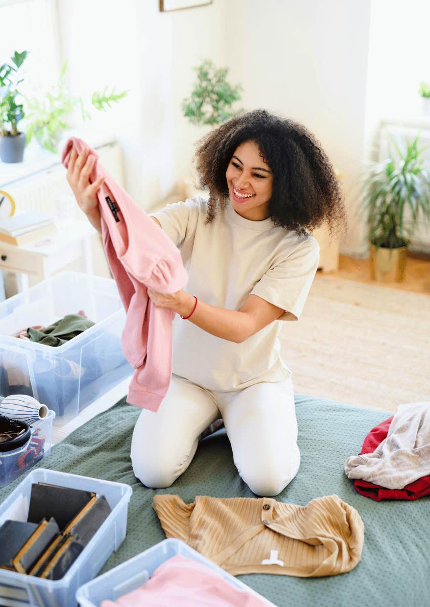 smiling woman decluttering items