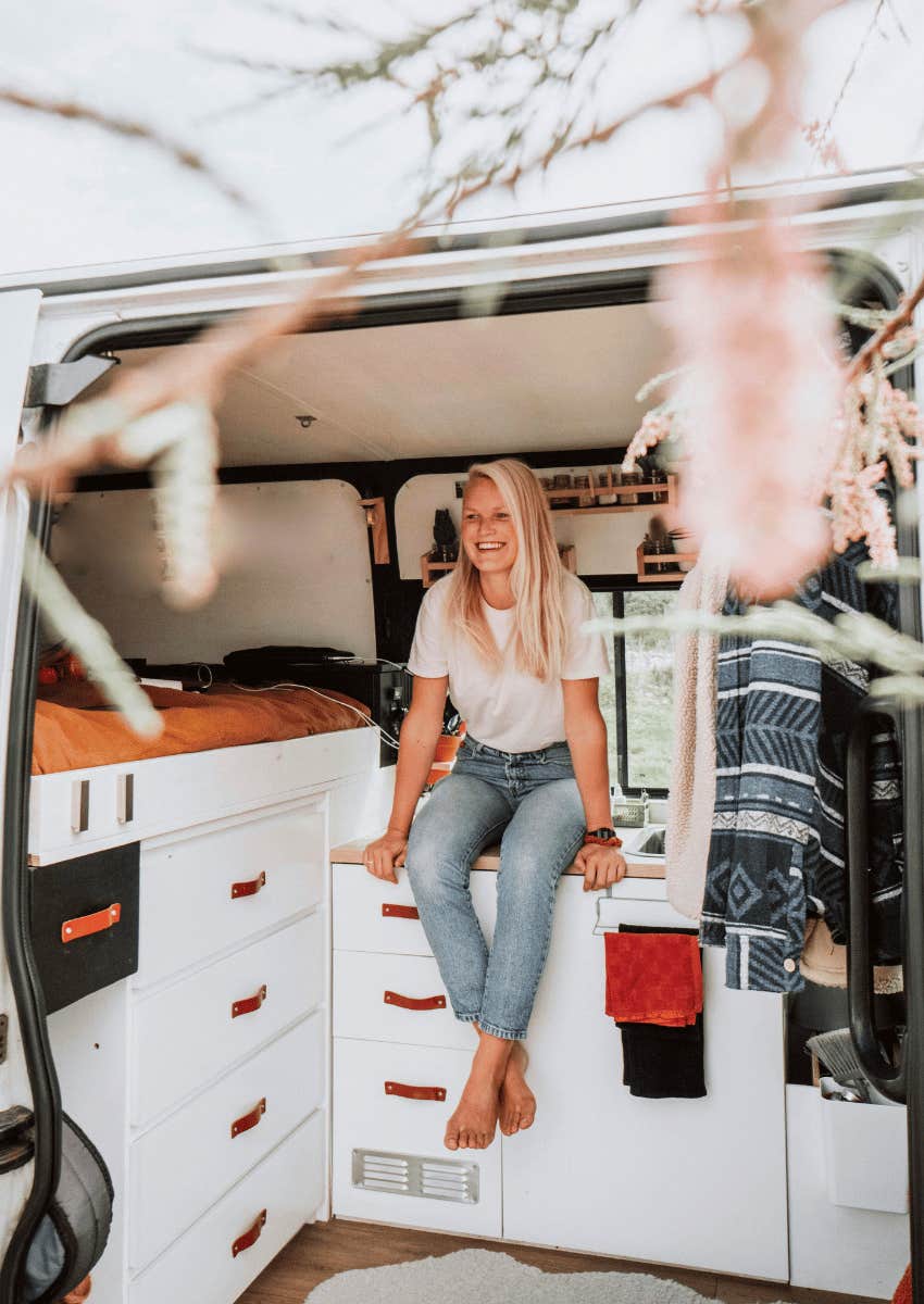 smiling woman living in a van