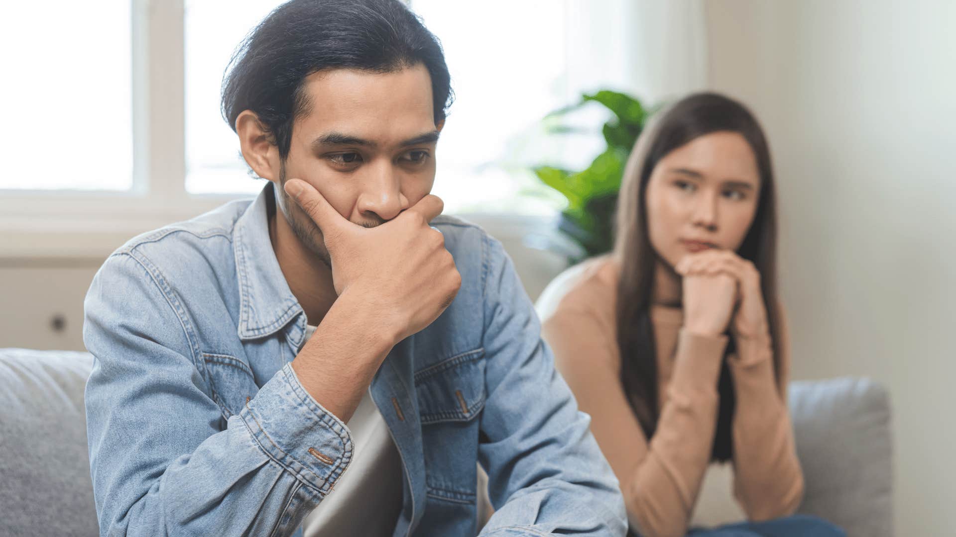 man with a fear of being replaced sitting with his wife