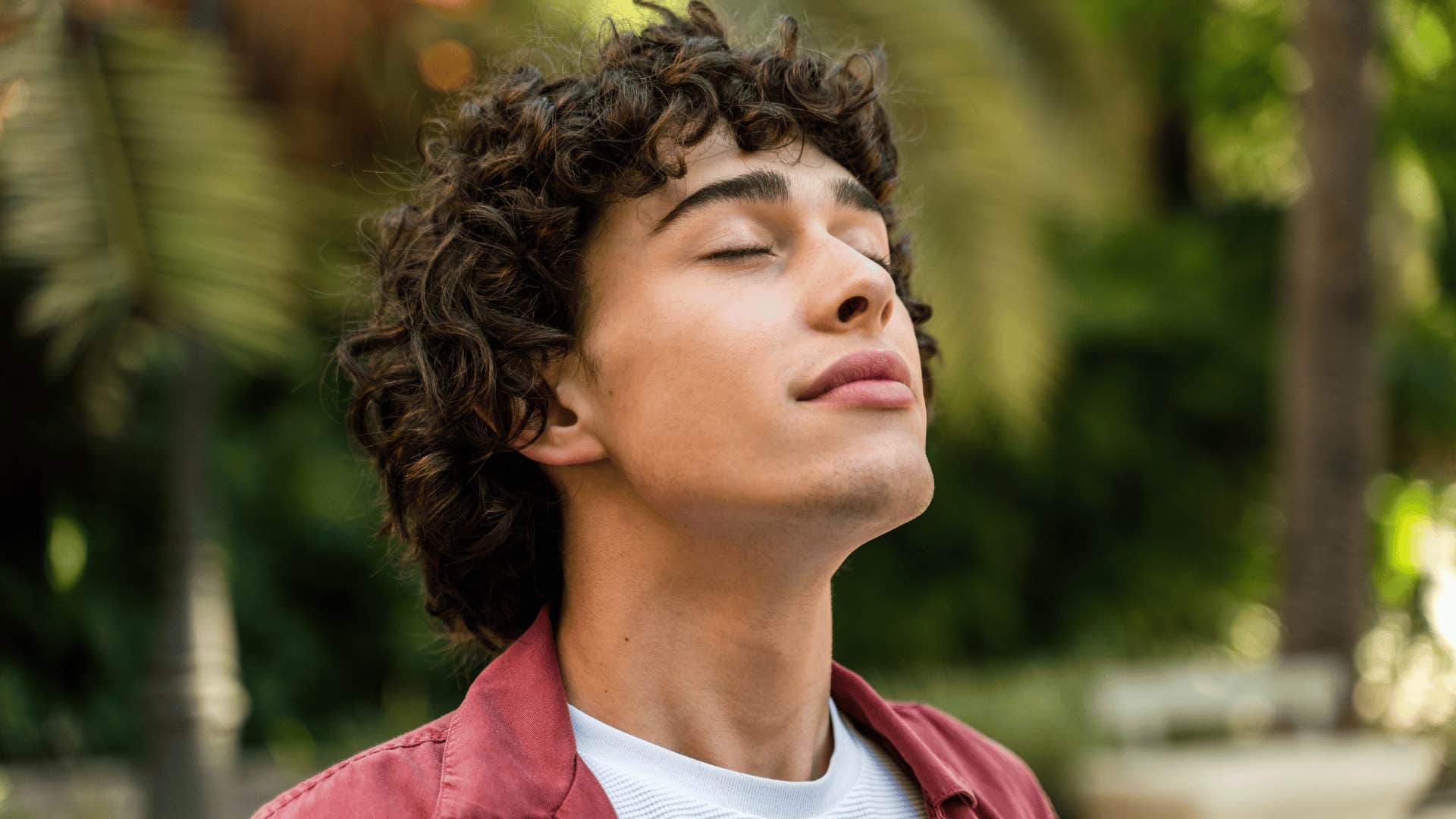 man embracing being alone outside