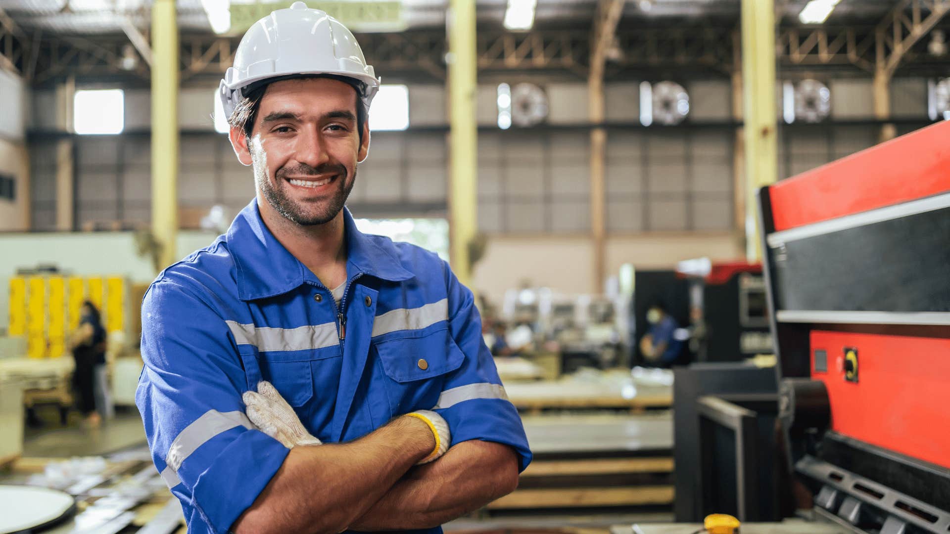 man working in a garage not defining his worth by his job