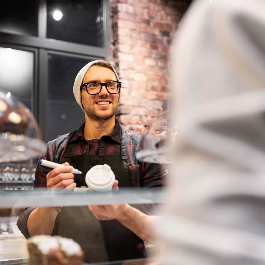 Barista judging someone's names before writing them on a cup.