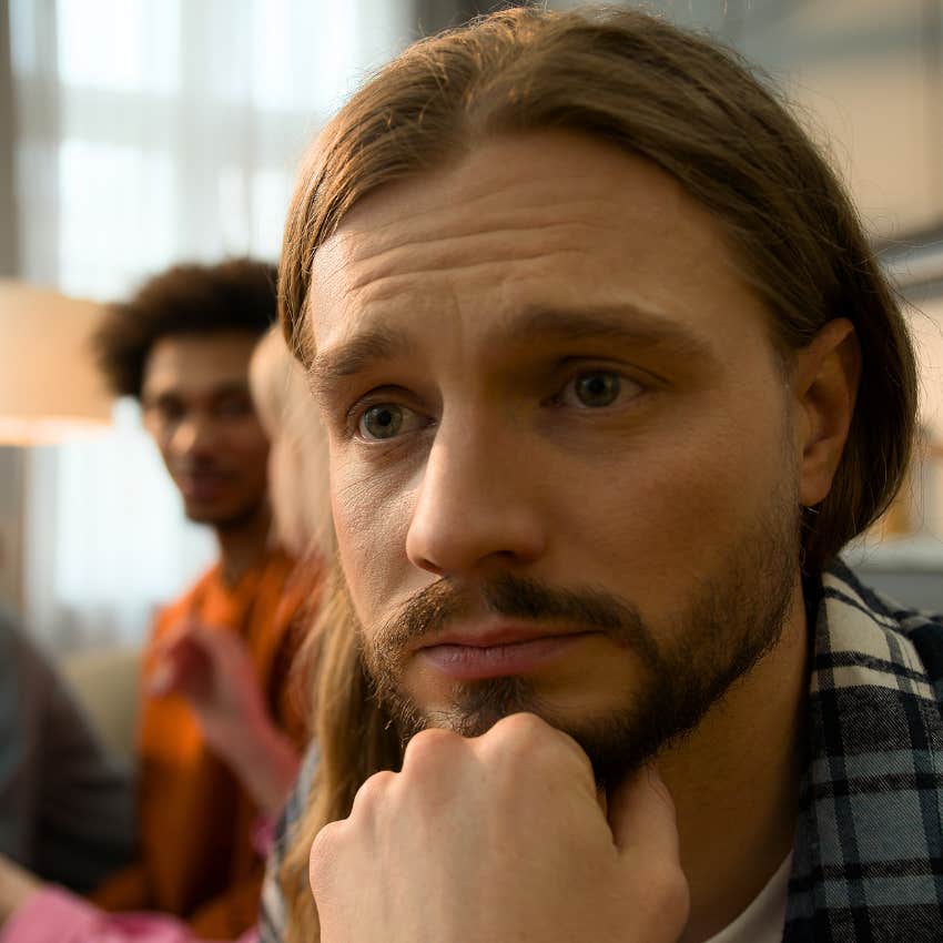 Man using the victim mentality and looking judgmental with friends.