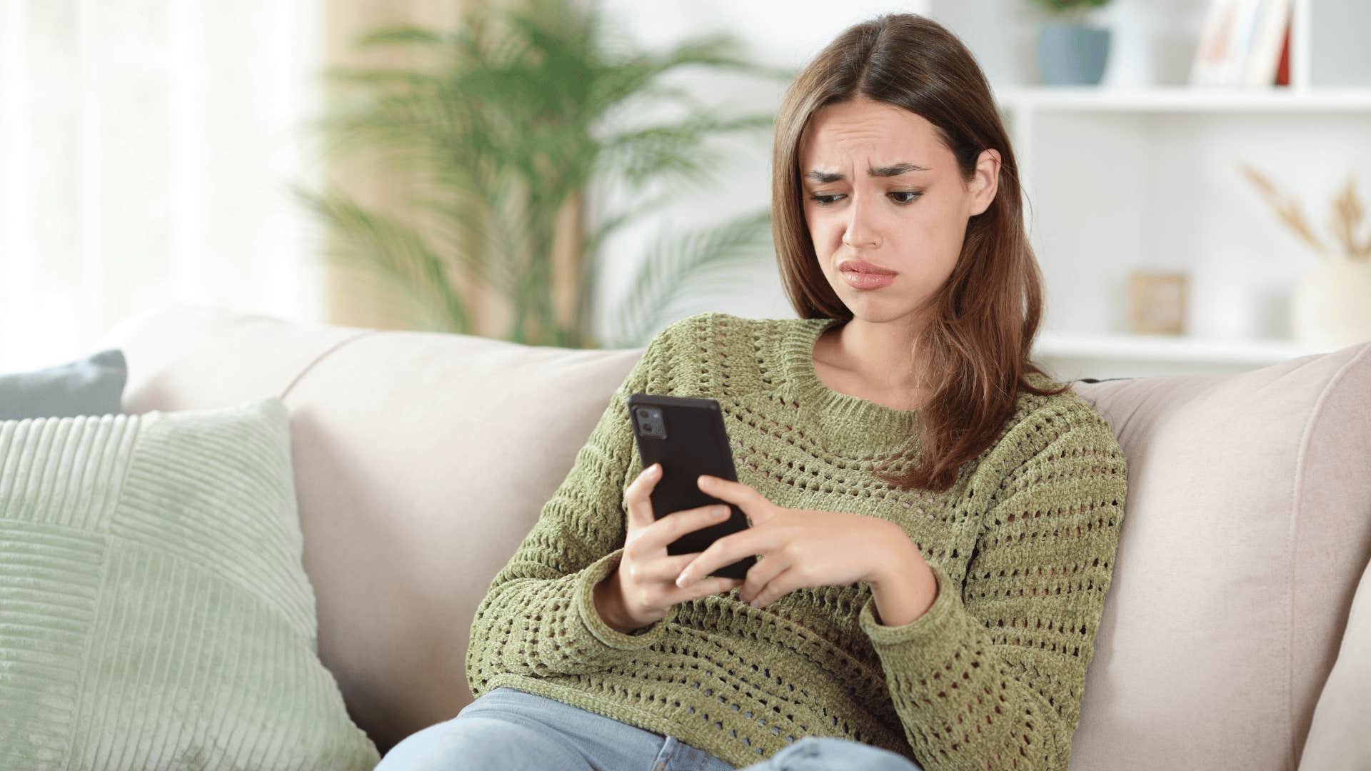 woman on her phone texting if it were true i would've heard it by now