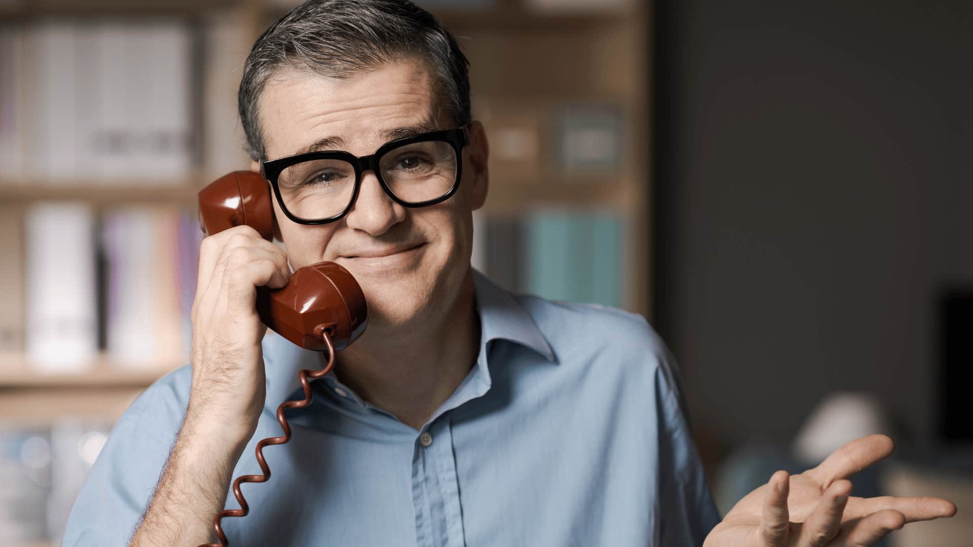 man on the phone in a conversation saying it worked for me smugly