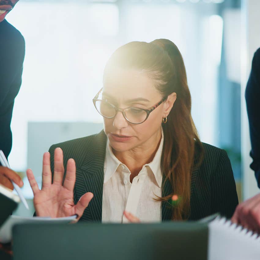 investment banker slammed with work at her job