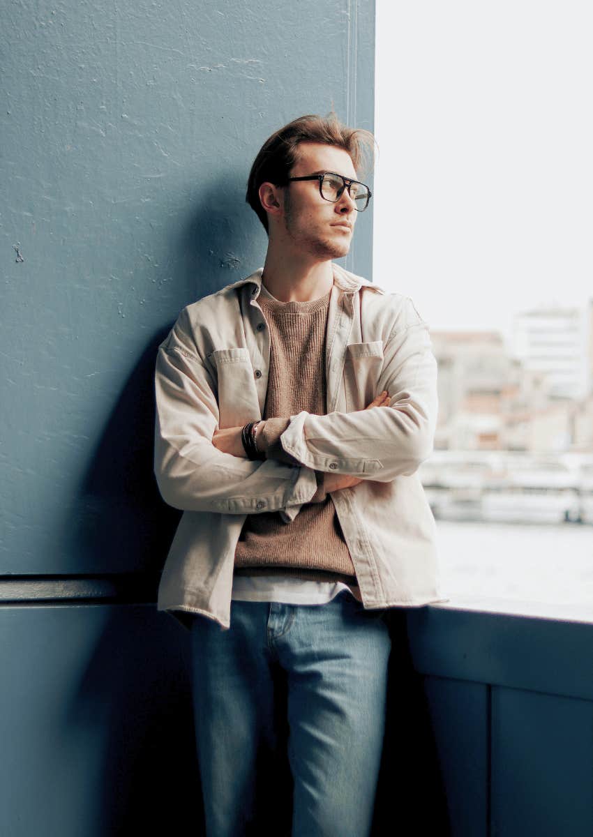stubborn man with his arms crossed and looking away