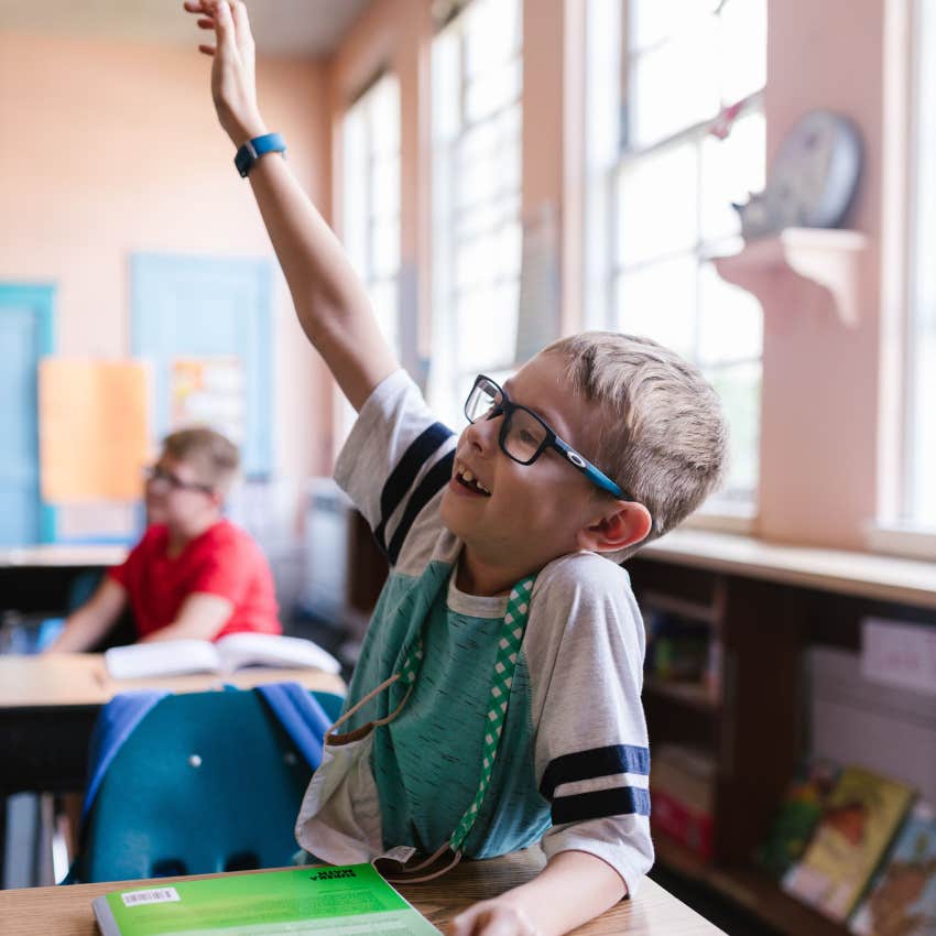 student moving to raise his hand