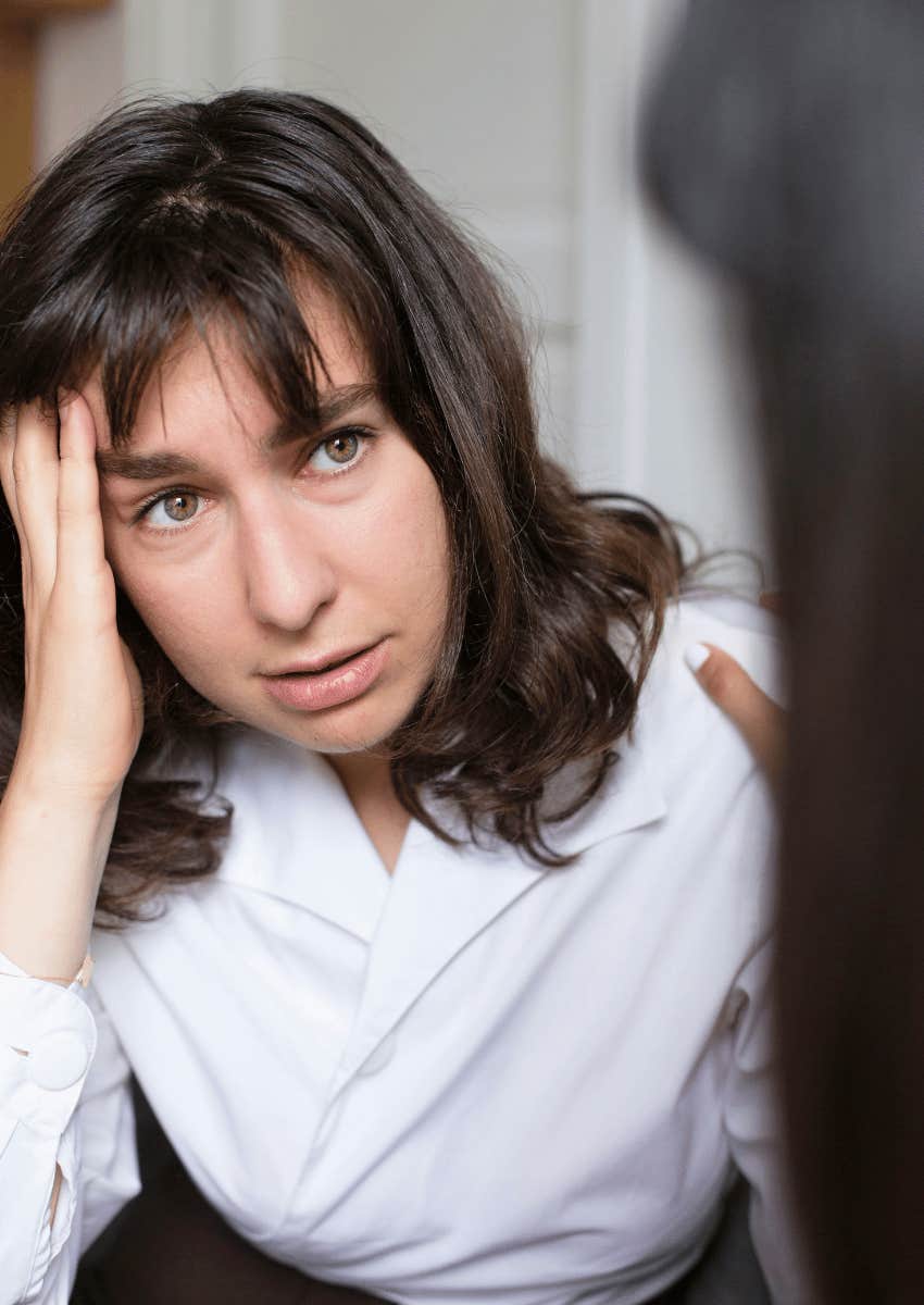 suspicious woman talking to her friend