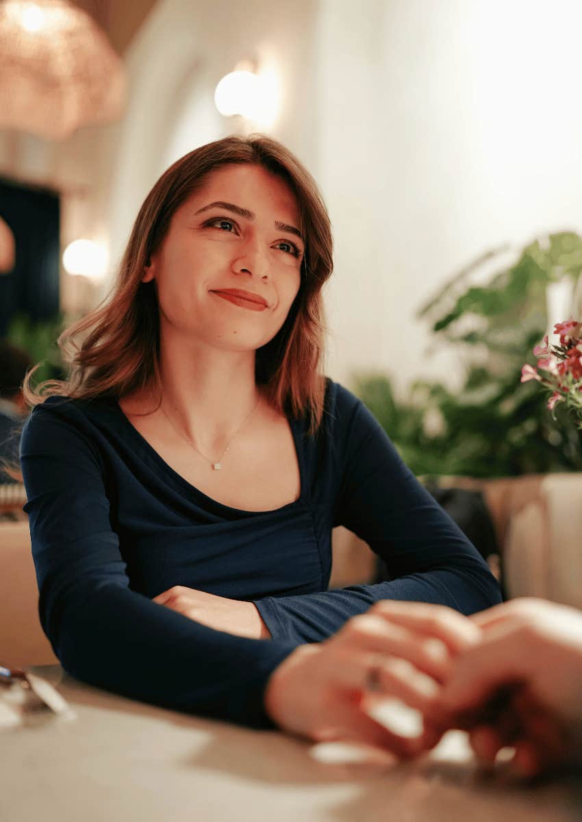 woman with a sweet smile on a first date 