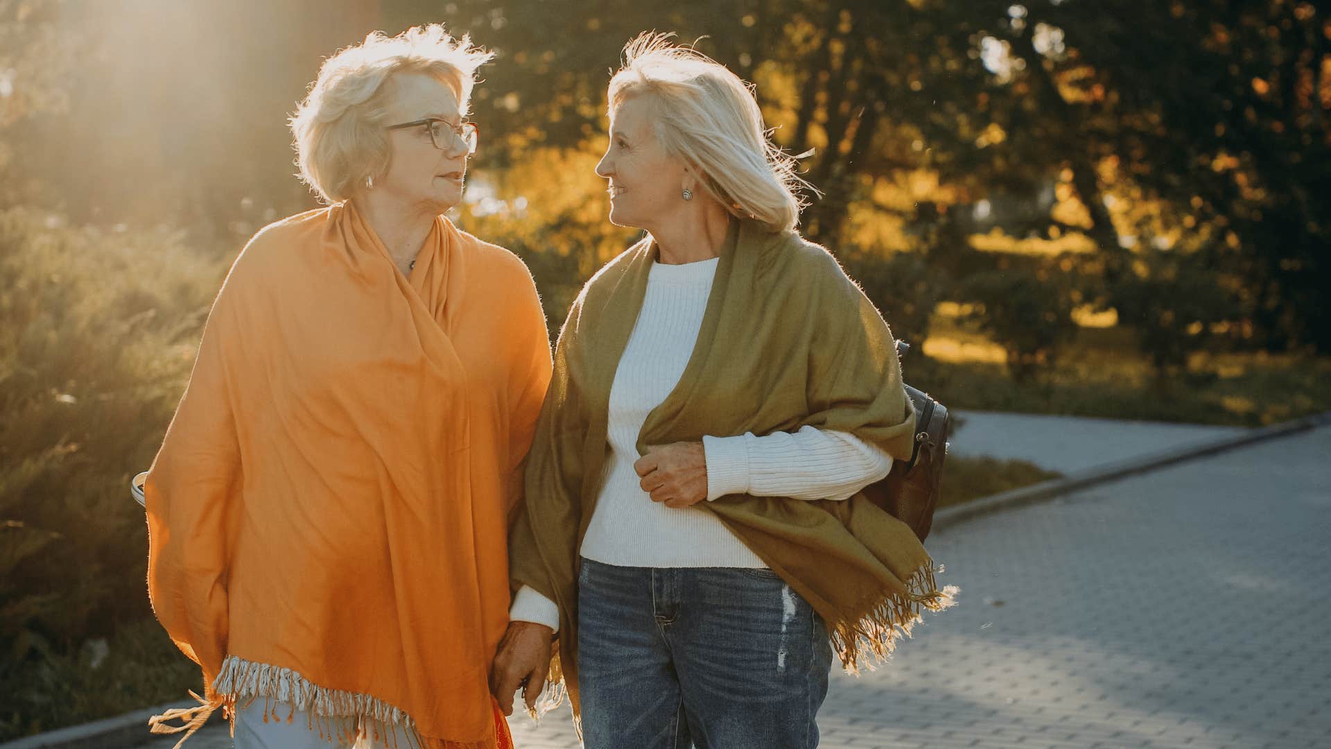 older women walking next to friend saying i understand where you're coming from