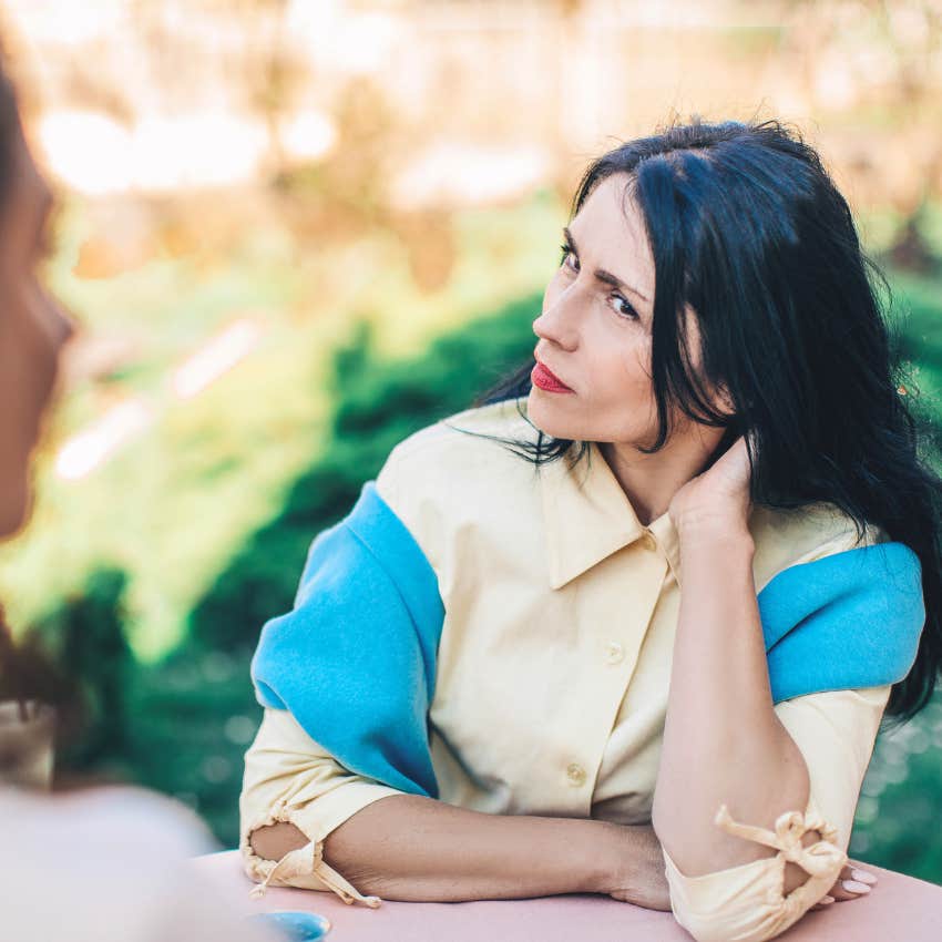 Woman with passive-aggressive tendencies looking at her friend.