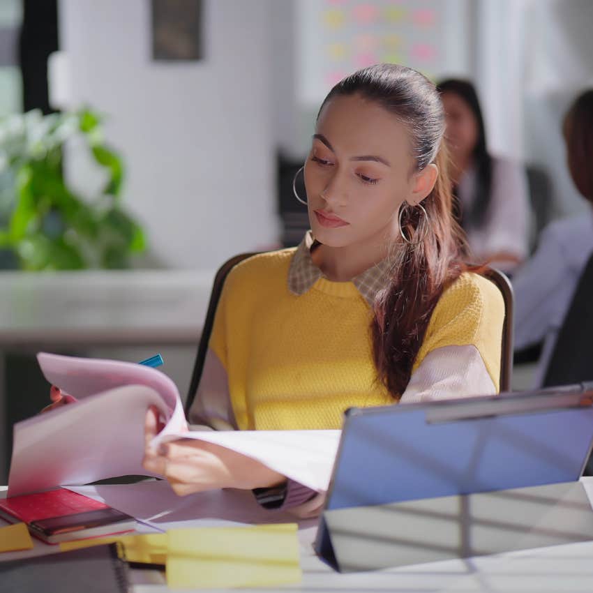 gen z employee annoyed at her workload in the office