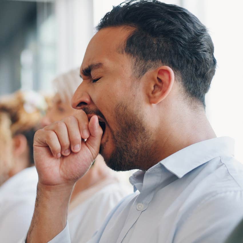 gen x man yawning during meeting at work