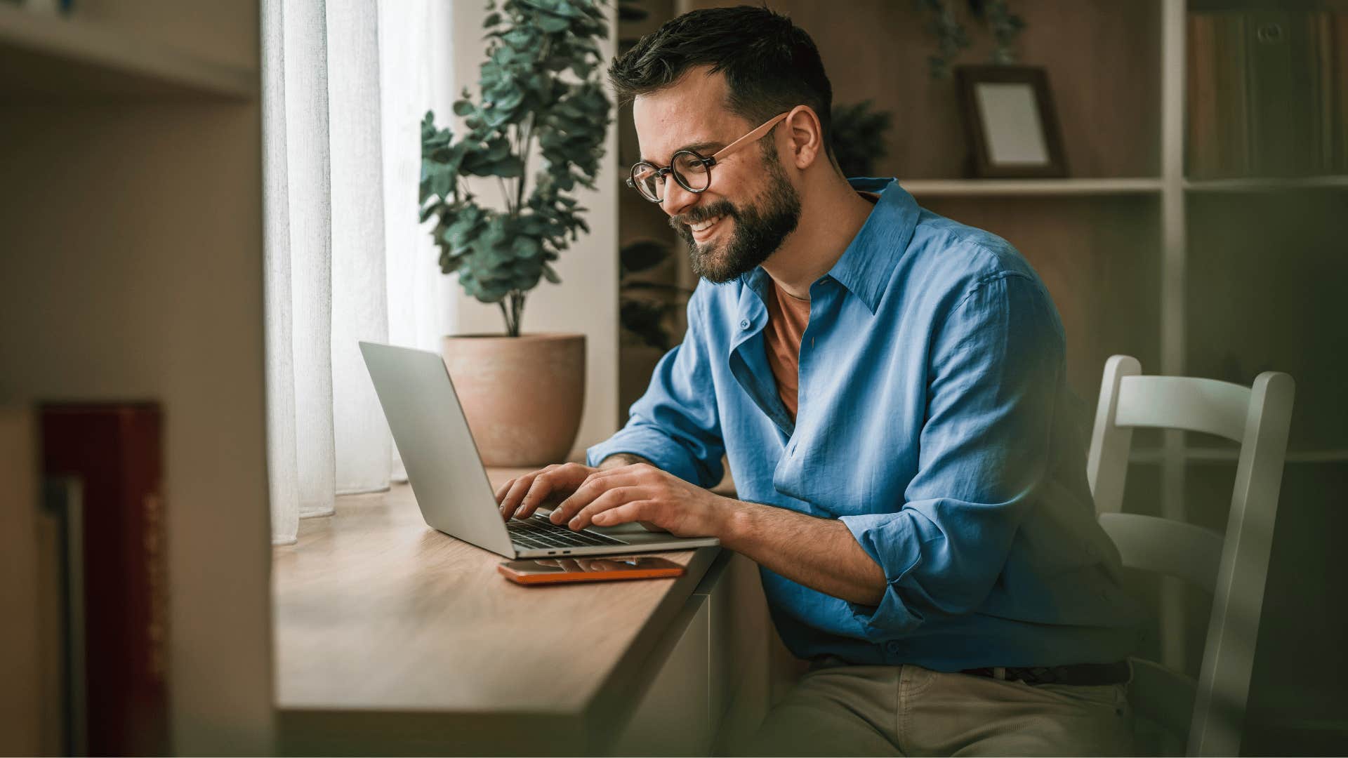 man building wealth while working on laptop