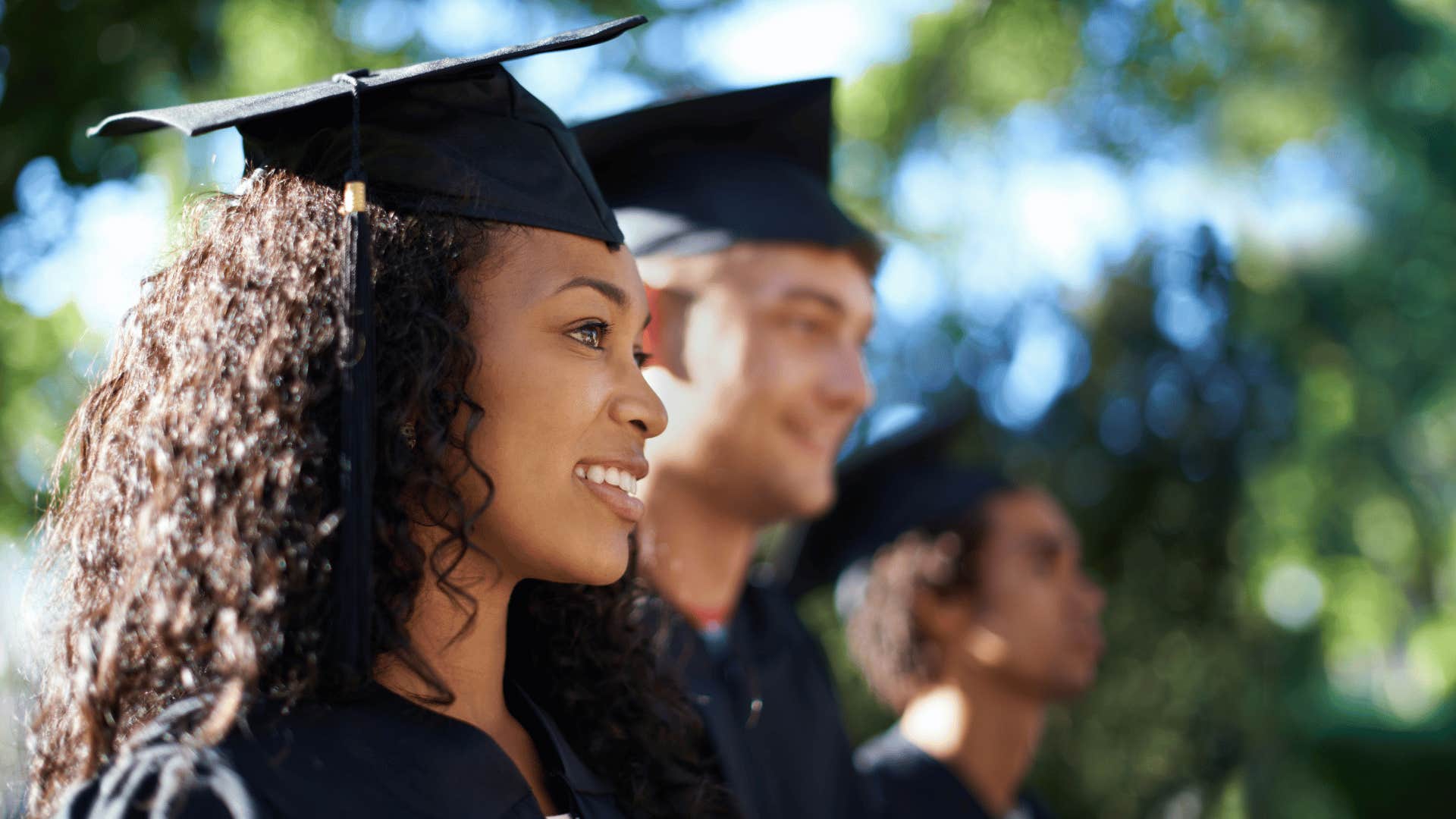 woman in cap and gown graduating college