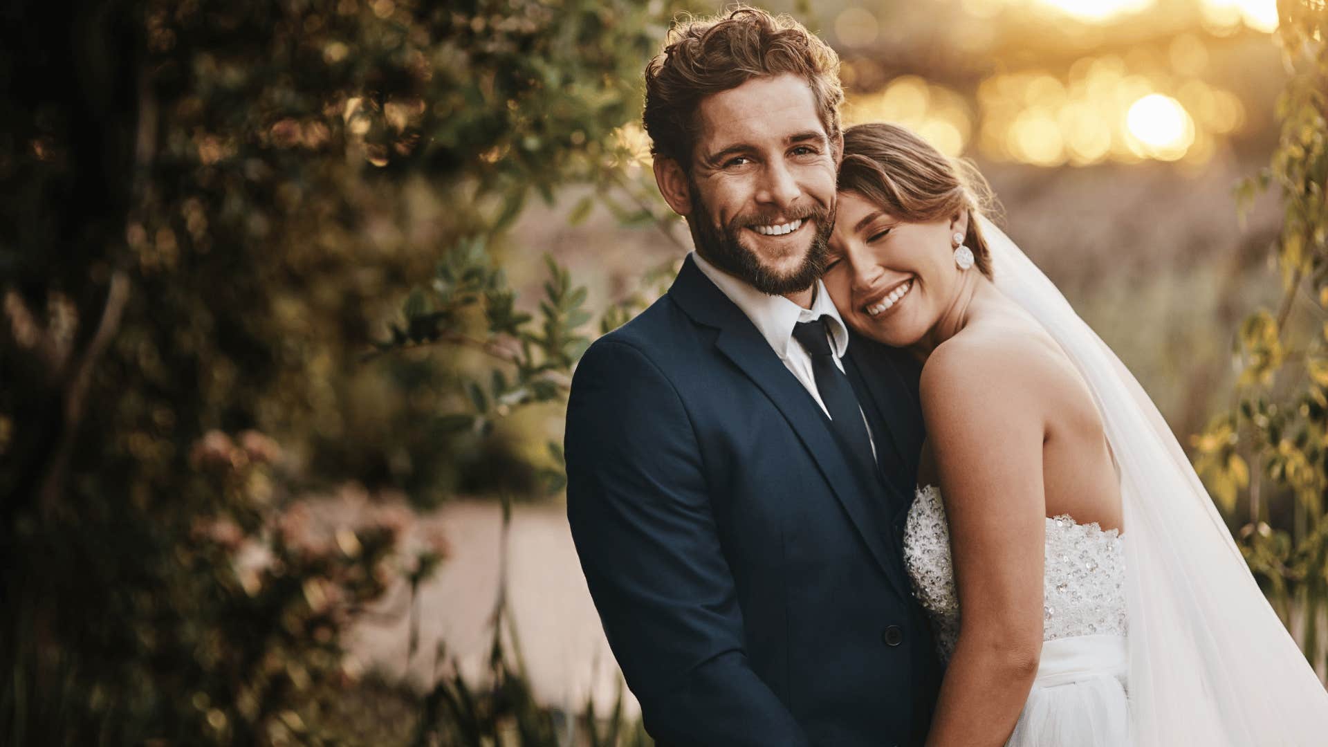 bride and groom smiling for wedding photos