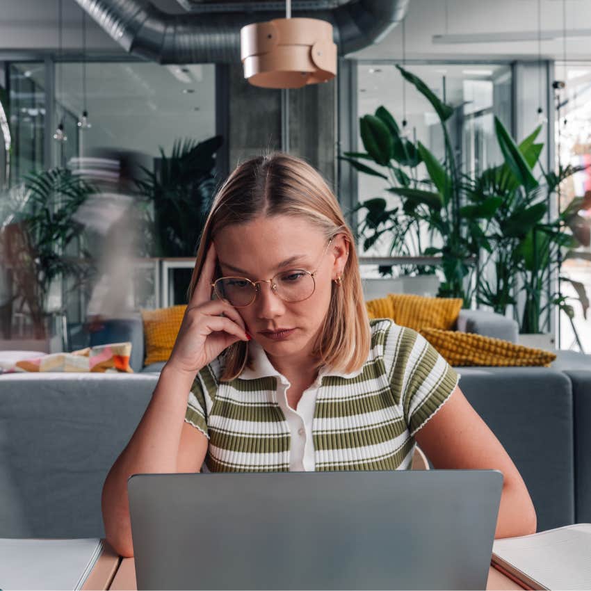 woman lacking mental sharpness multitasking at work and looking stressed