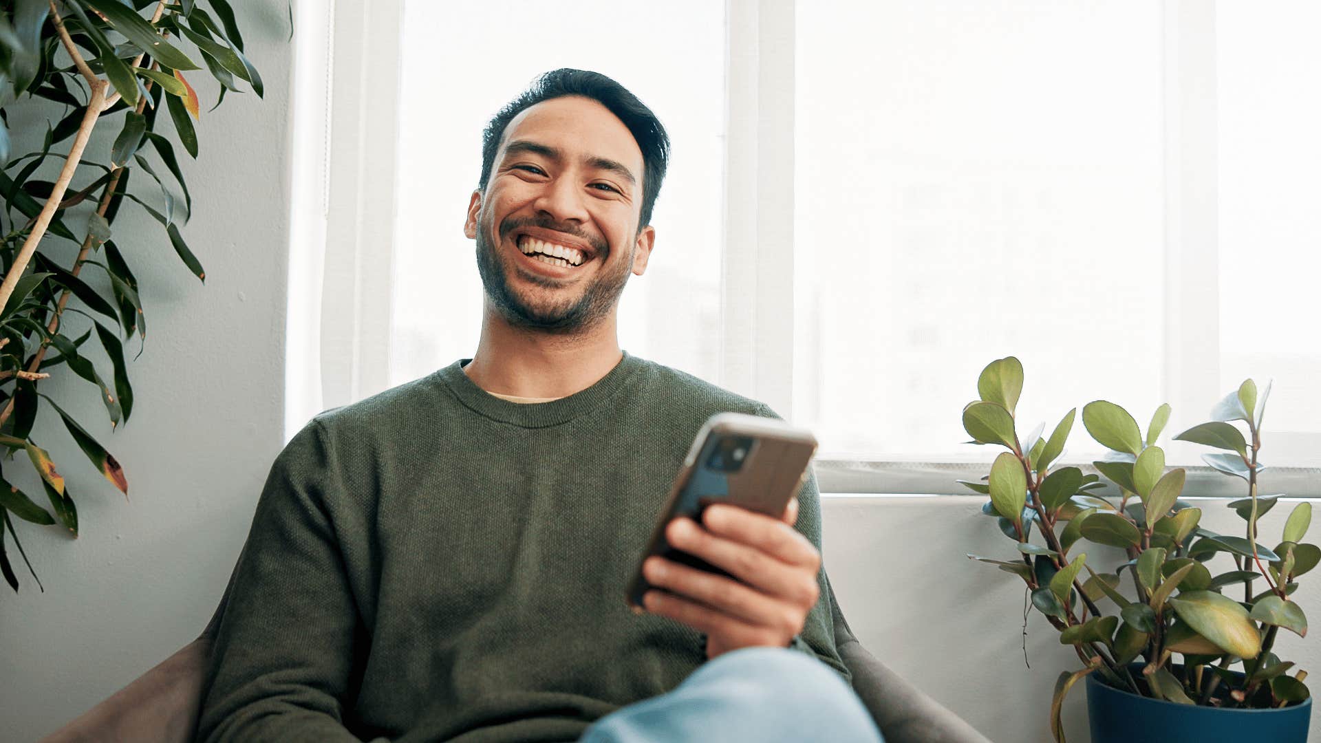 man laughing at a meme