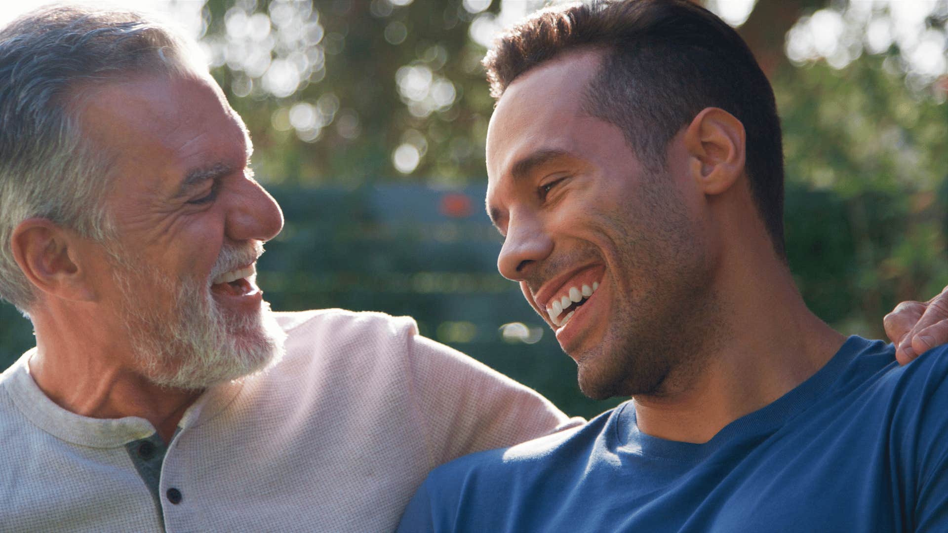 dad laughing about a rumor with his son