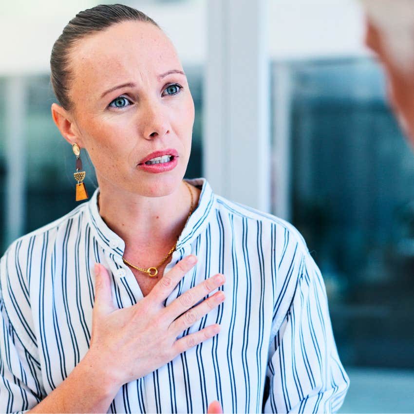 Woman with sharp intuition noticing someone's bad energy at work.