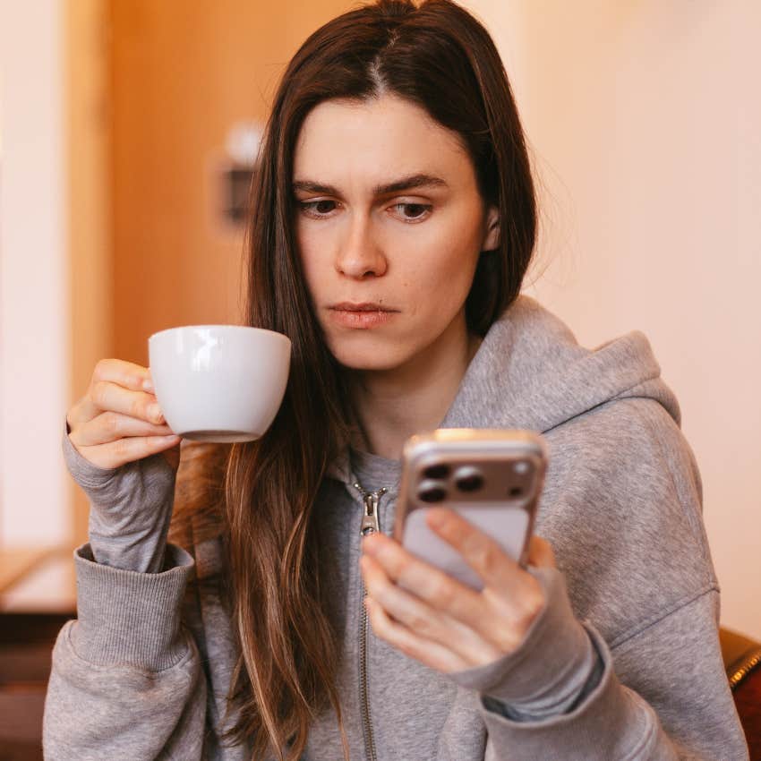 intelligent woman feeling drained after looking at unexpected notifications and messages on her phone
