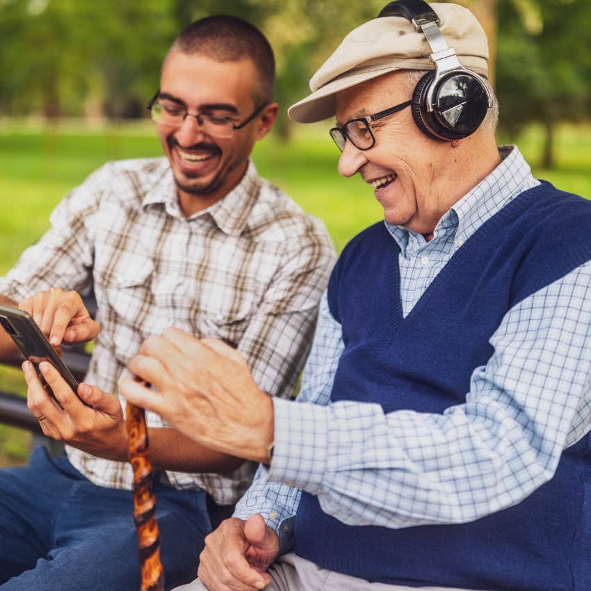 gen X man respecting his elders sitting with grandparent