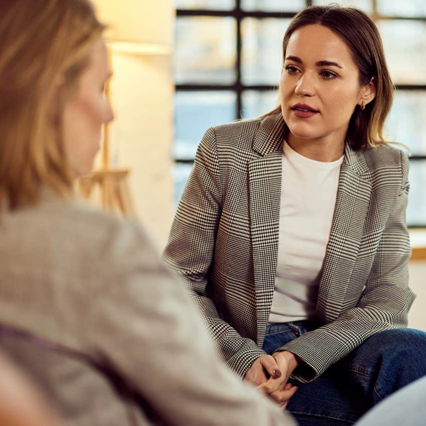 intelligent woman at work talking to colleague