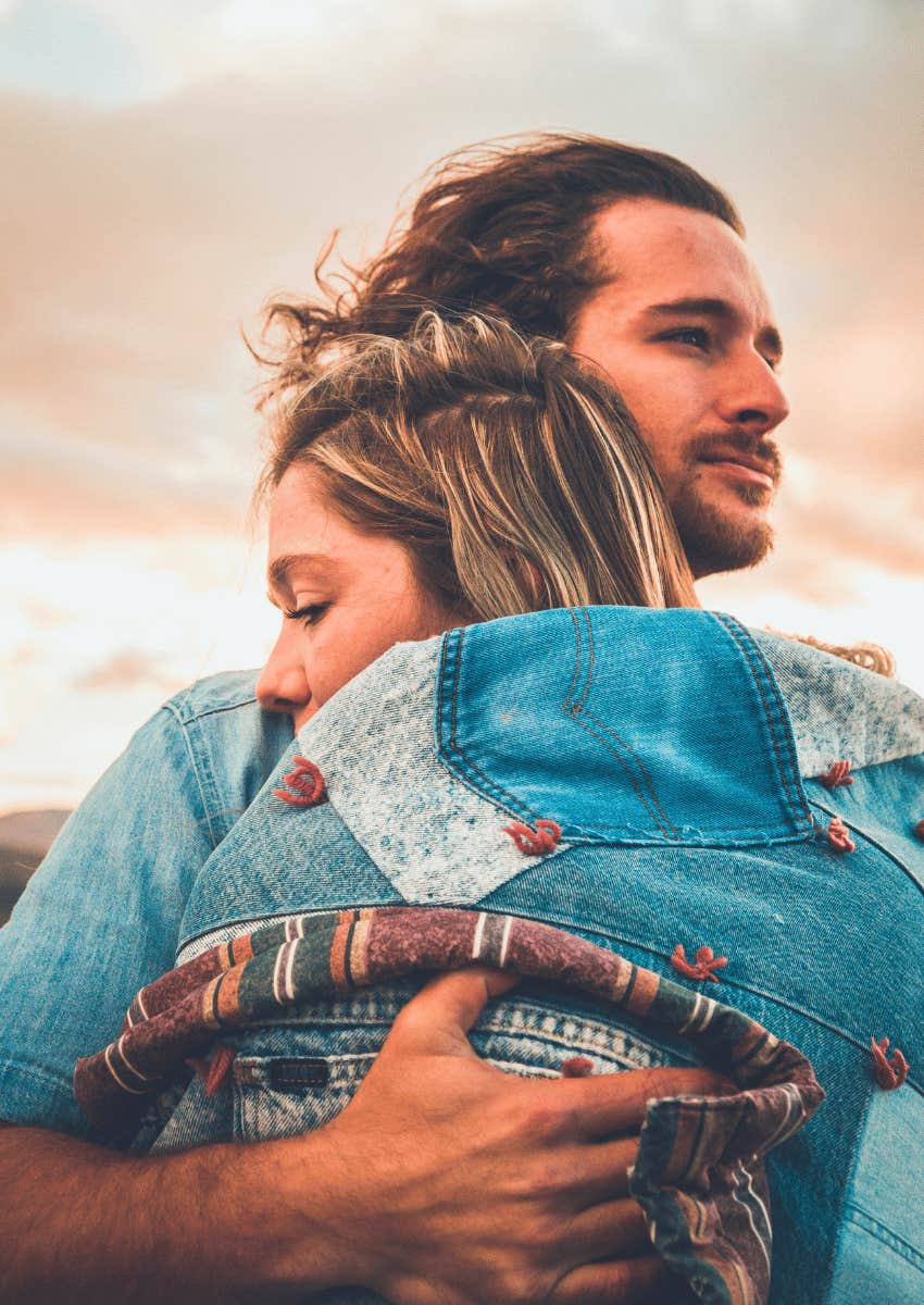 trusting couple hugging each other close