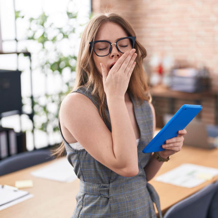 gen z worker yawning in the office being perceived as lazy