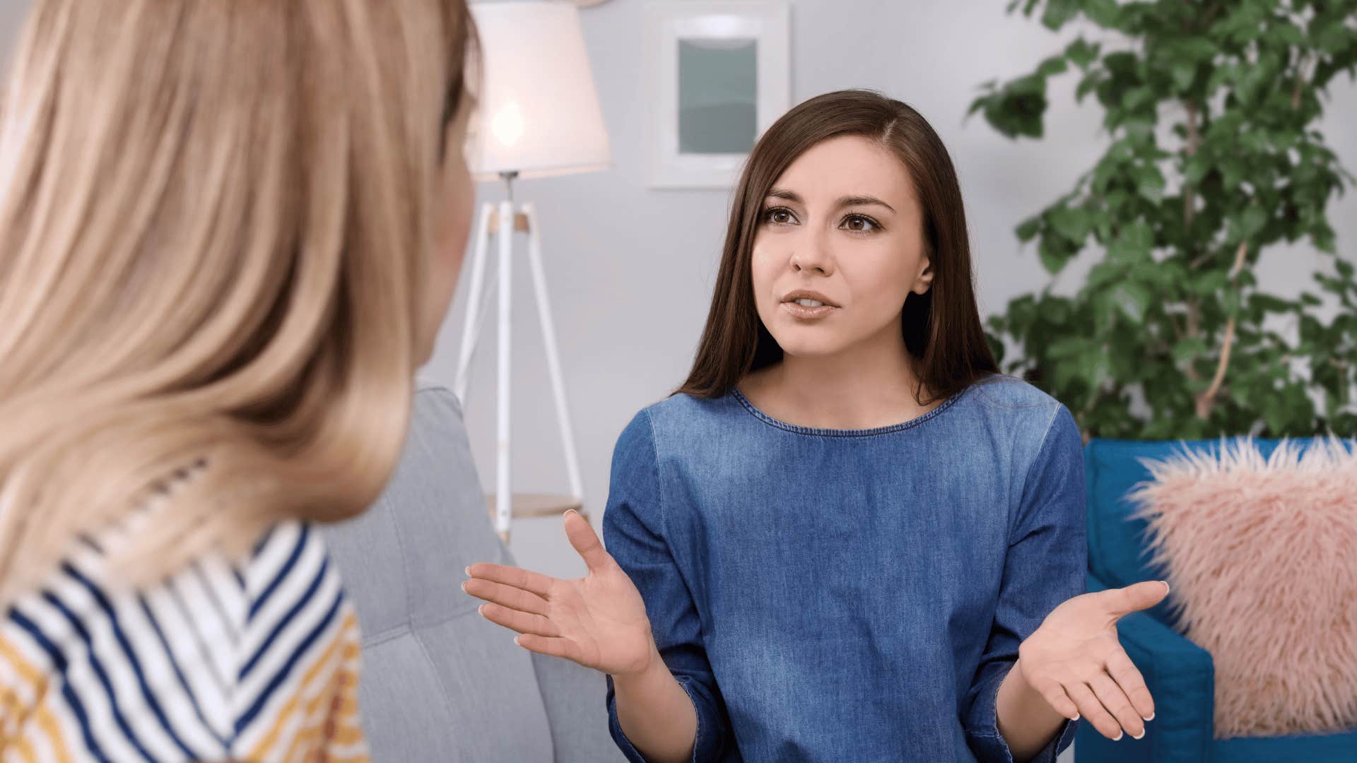 insecure woman being dismissive to friend telling her i don't even care