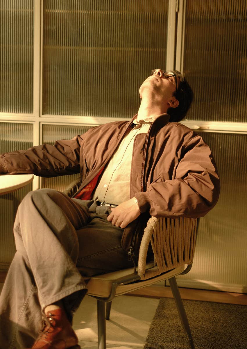 vintage image of exhausted employee leaning back in chair