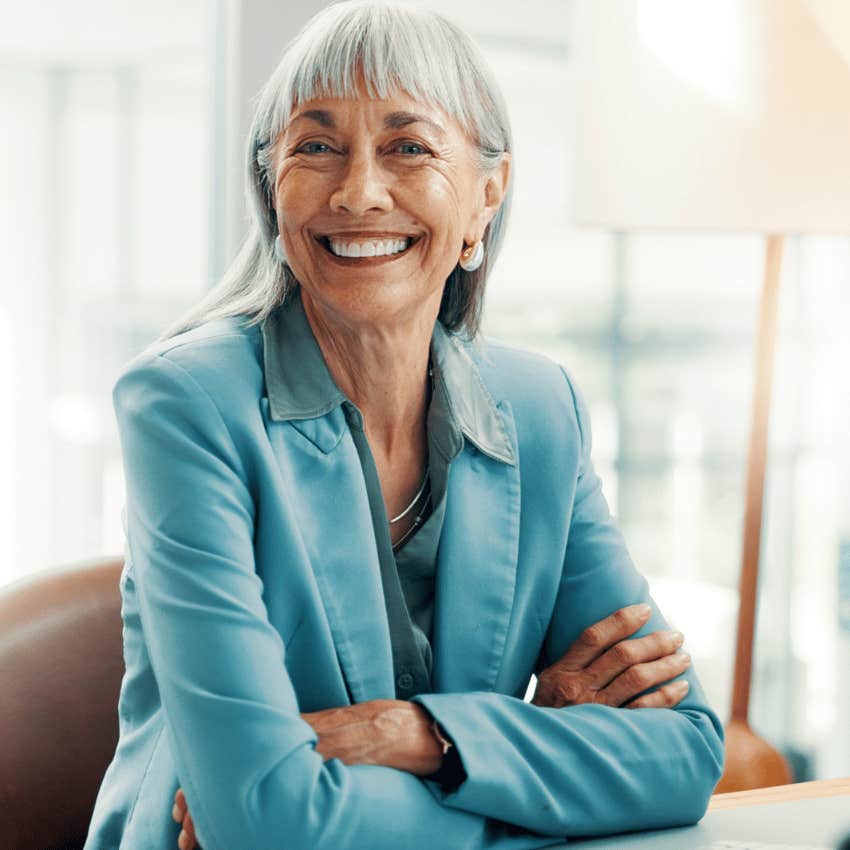 gorgeously unbothered woman smiling not trying to control everything at work
