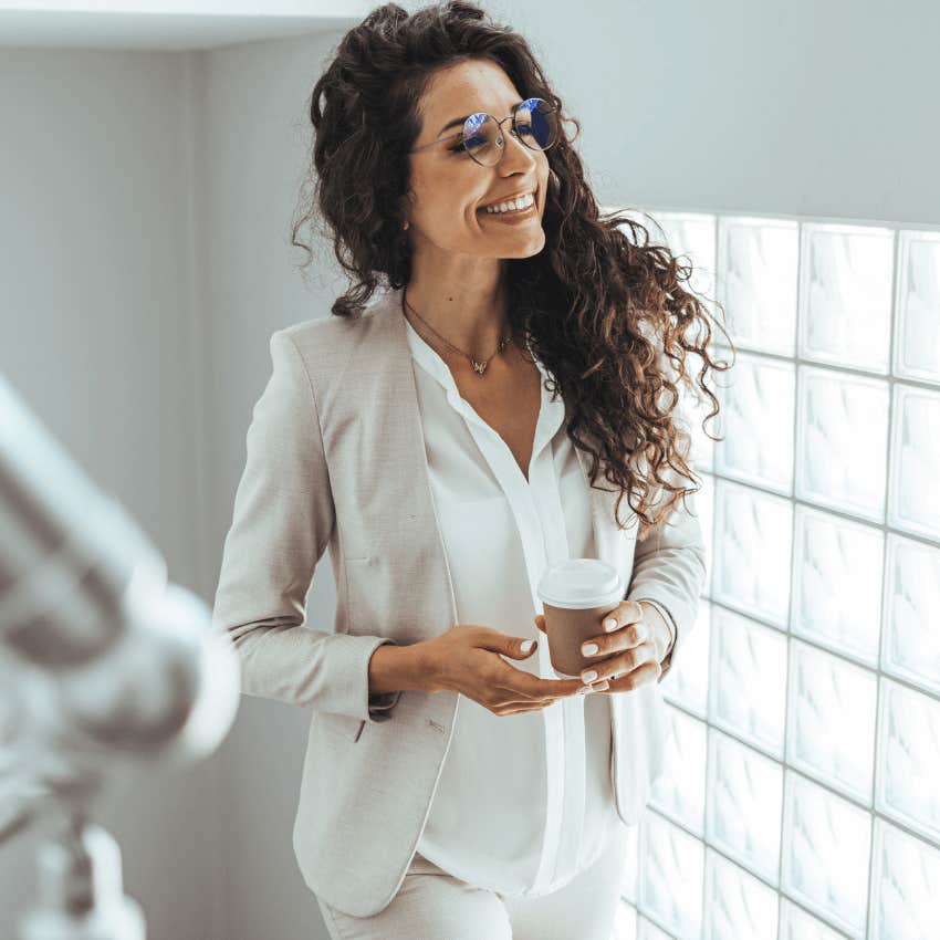 unbothered woman at work moving with intention around office