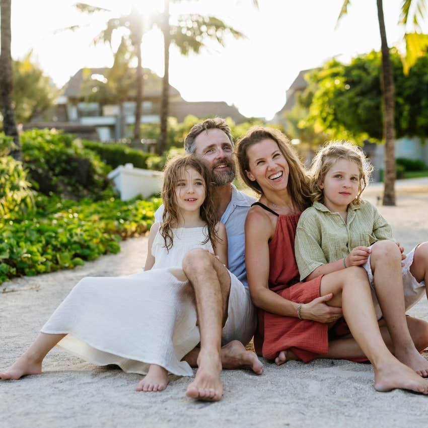 family enjoying vacation on beach