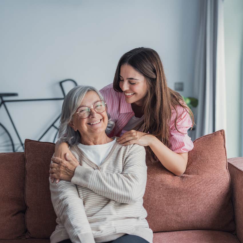 adult daughter with arm around senior mother