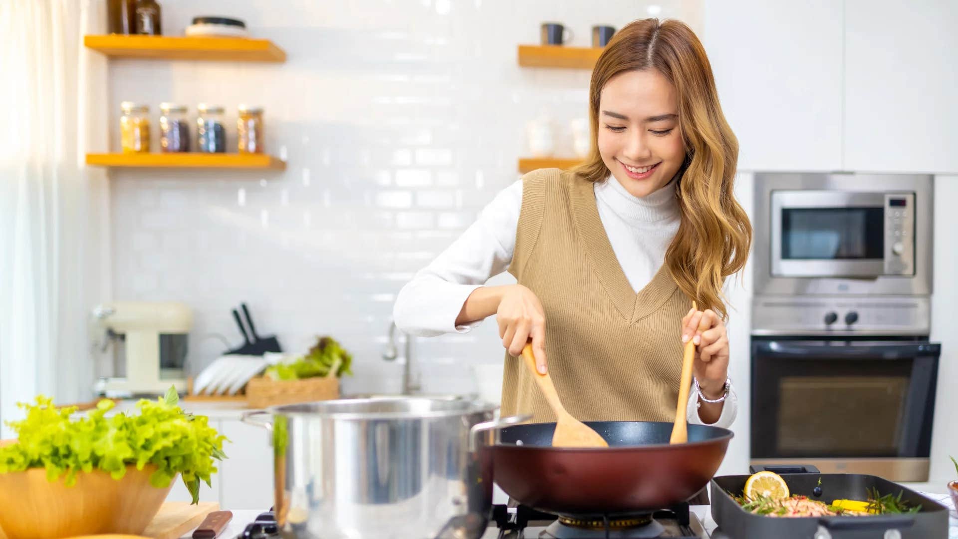self-reliant woman cooking in kitchen 