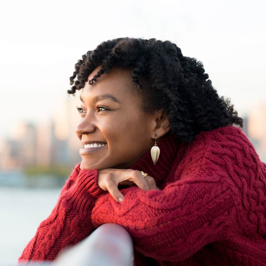 happy woman staring peacefully not caring what others think