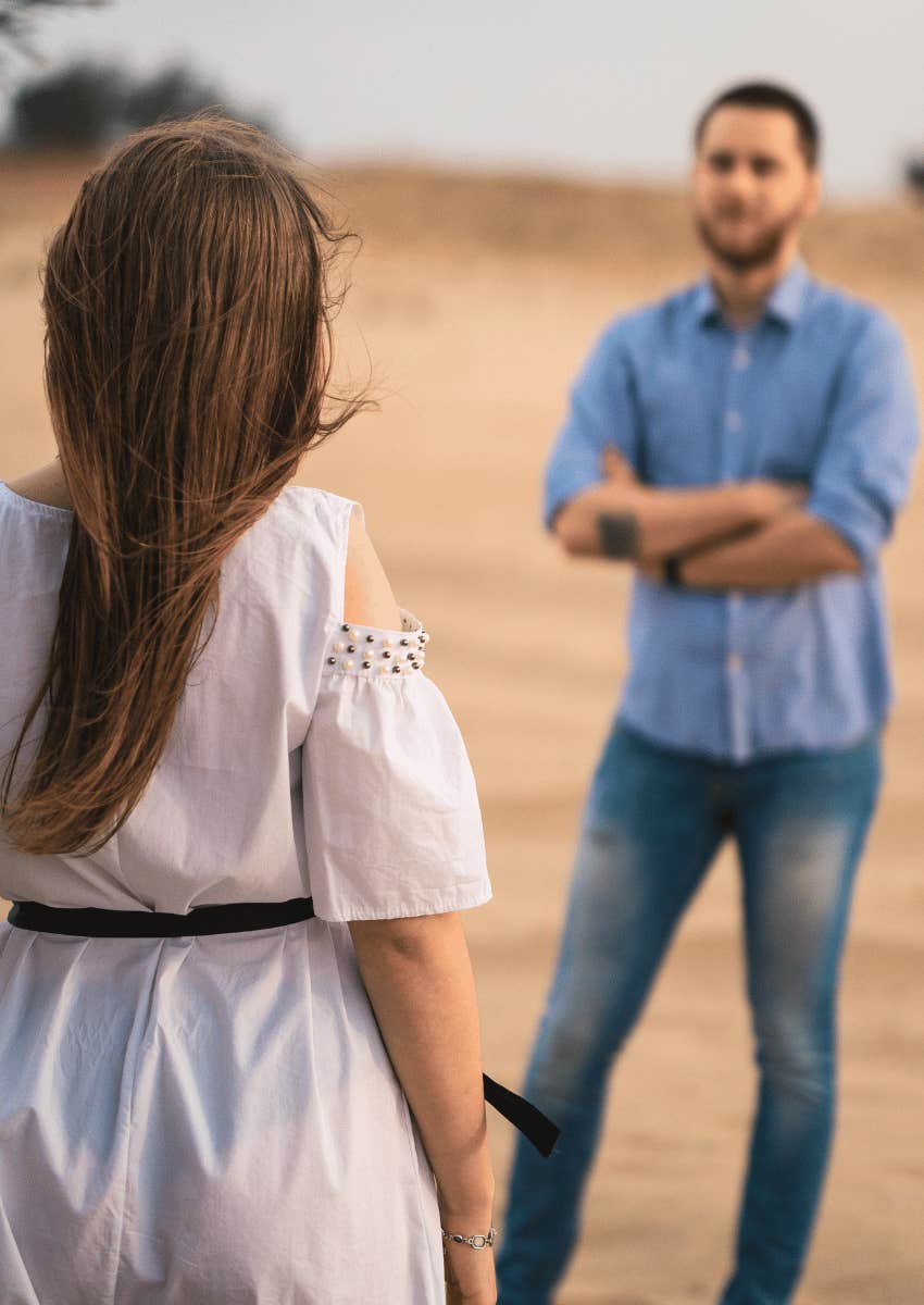 woman facing man throwing a tantrum