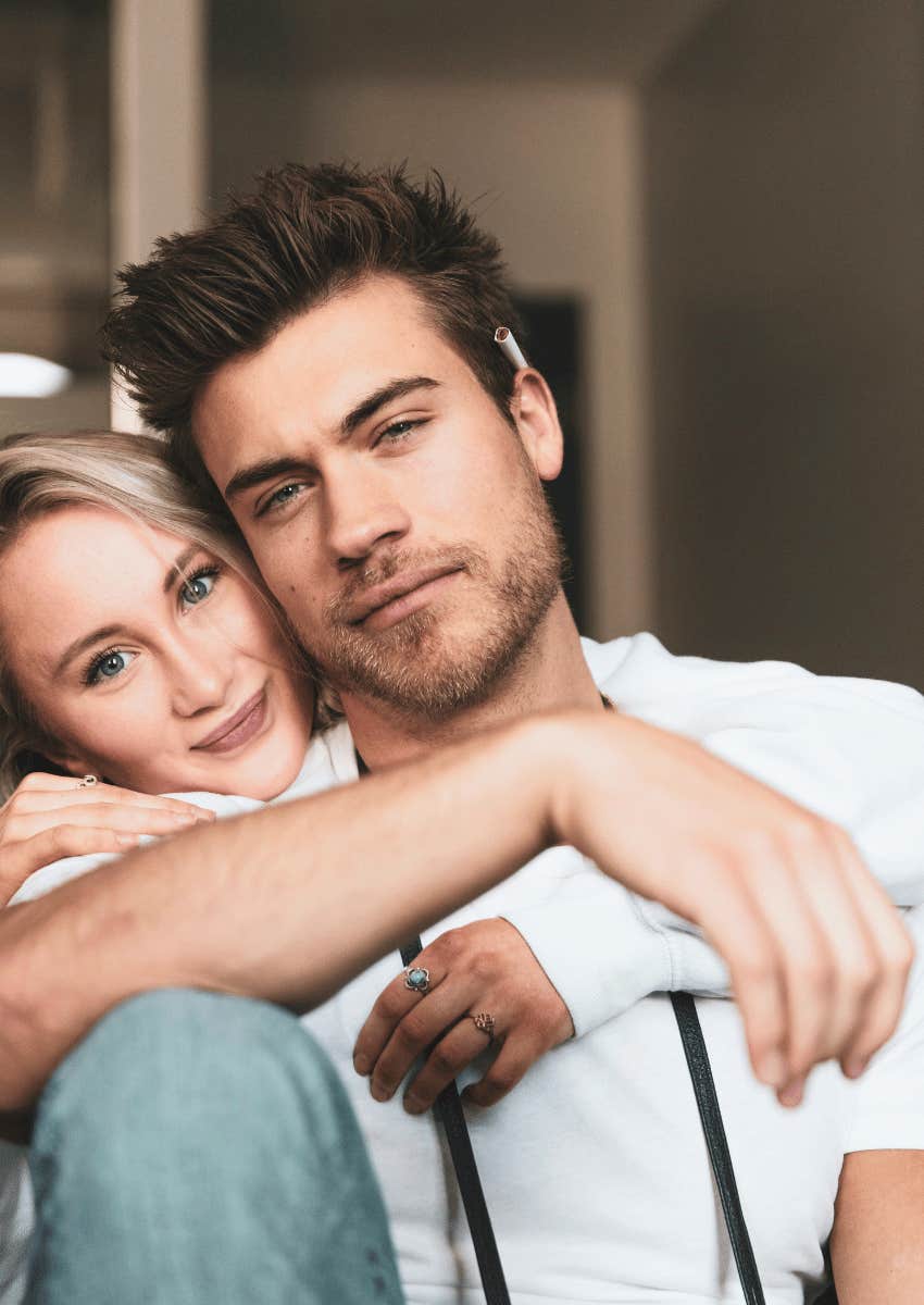 woman hugging confident man