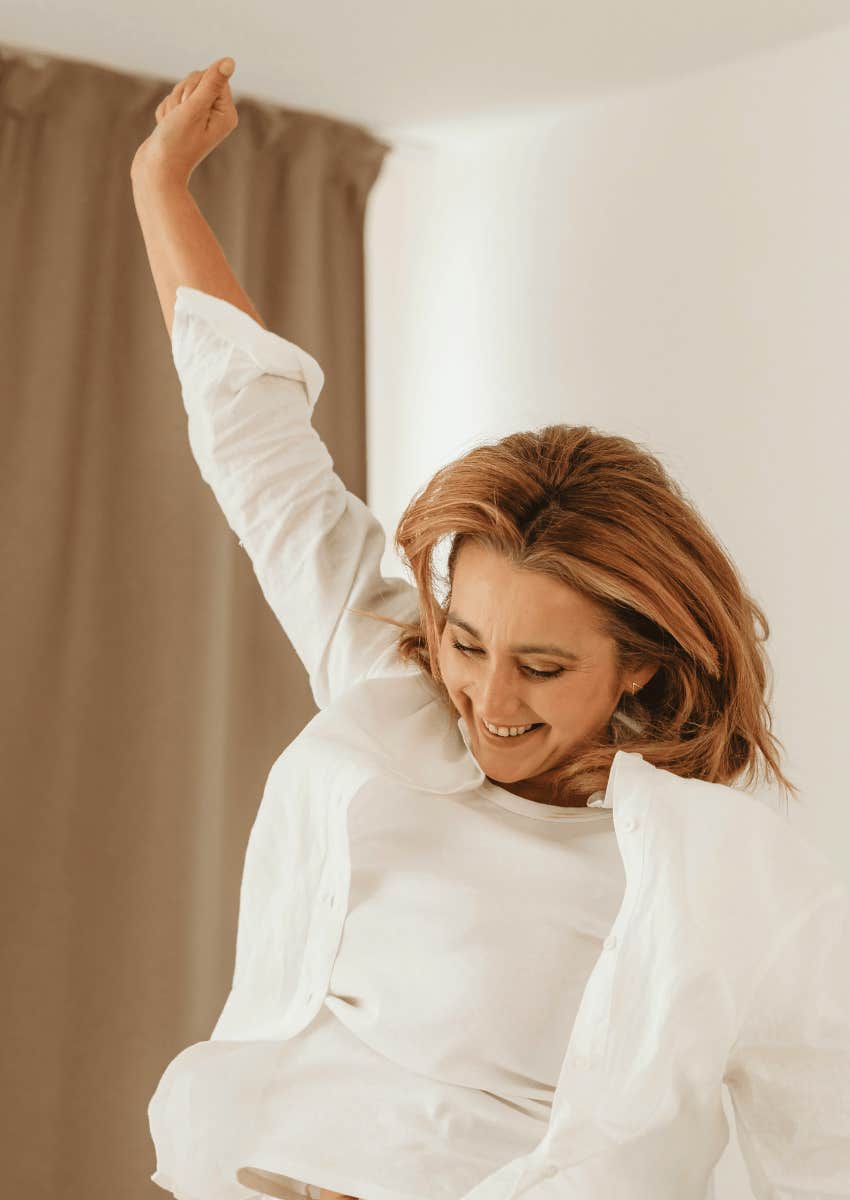 woman jumping feeling natural